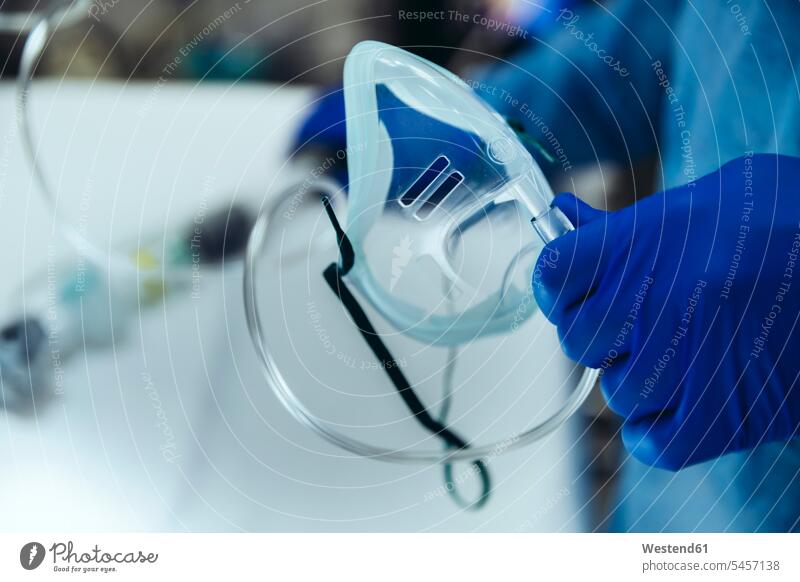 Close-up of emergeny doctor holding an oxygen mask in hospital Occupation Work job jobs profession professional occupation At Work health healthcare