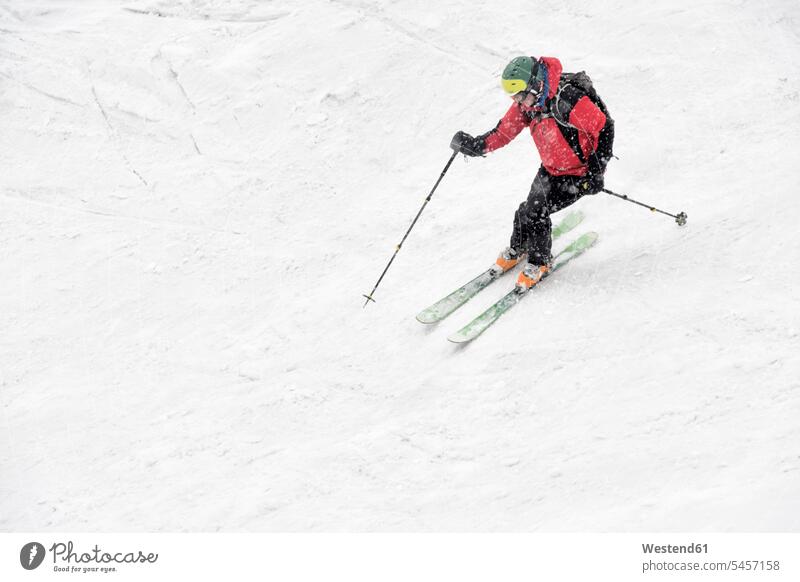 Georgia, Caucasus, Gudauri, man on a ski tour riding downhill Traveller Travellers Travelers Recreational Pursuit Recreational Activities Recreational Pursuits