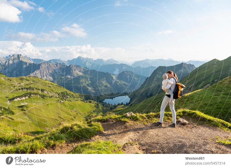 Germany, Bavaria, Oberstdorf, mother and little daughter on a hike in the mountains mommy mothers mummy mama daughters hiking parents family families people