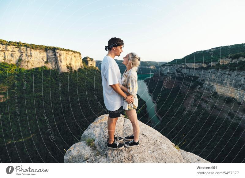 Young couple in love standing on viewpoint, Sau Reservoir, Catalonia, Spain human human being human beings humans person persons caucasian appearance