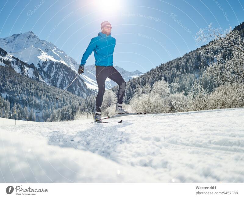 Austria, Tyrol, Luesens, Sellrain, cross-country skier in snow-covered landscape cross country skiing cross-country skiing snow covered covered in snow snowy