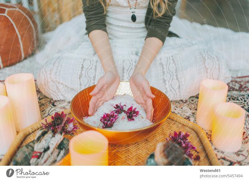 Hands in a salt bowl ceremony at a women's circle human human being human beings humans person persons Mixed Race mixed race ethnicity mixed-race Person 1