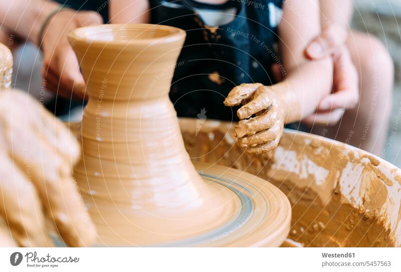 Close-up of father and daughter in a pottery workshop human human being human beings humans person persons caucasian appearance caucasian ethnicity european