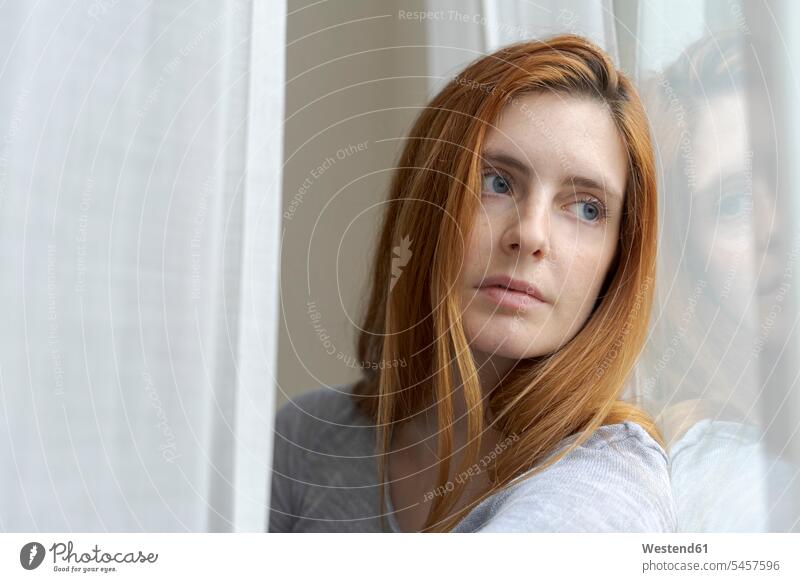 Portrait of serious young woman looking out of window human human being human beings humans person persons caucasian appearance caucasian ethnicity european 1