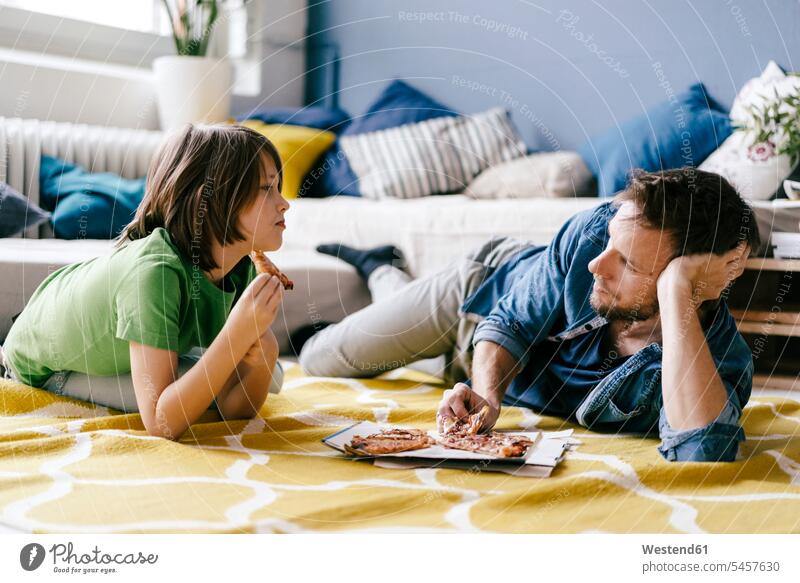 Father and son eating pizza on the floor at home father pa fathers daddy dads papa Pizza Pizzas floors sons manchild manchildren parents family families people