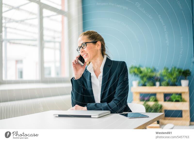 Businesswoman working from home, talking on the phone at home sustainability sustainable expertise competence competent businesswoman businesswomen