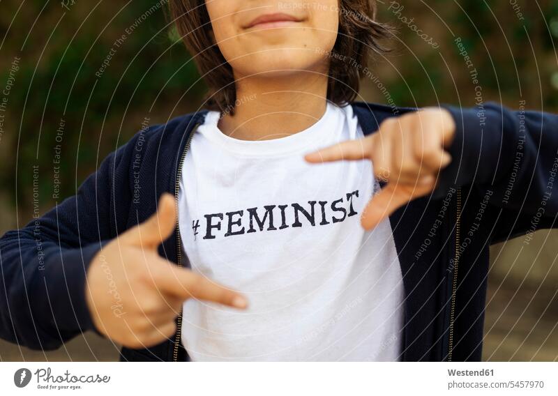 Little boy standing in the street with print on t-shirt, saying Feminist, making finger frame T- Shirt t-shirts tee-shirt being proud Ideas script scripture
