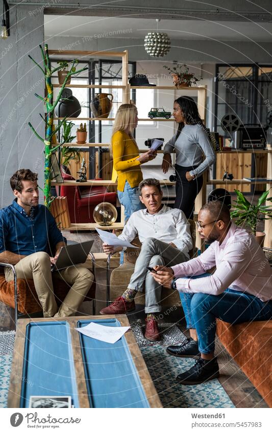 Business team having an informal meeting in loft office Business Meeting business conference business world business life casual lofts discussing discussion