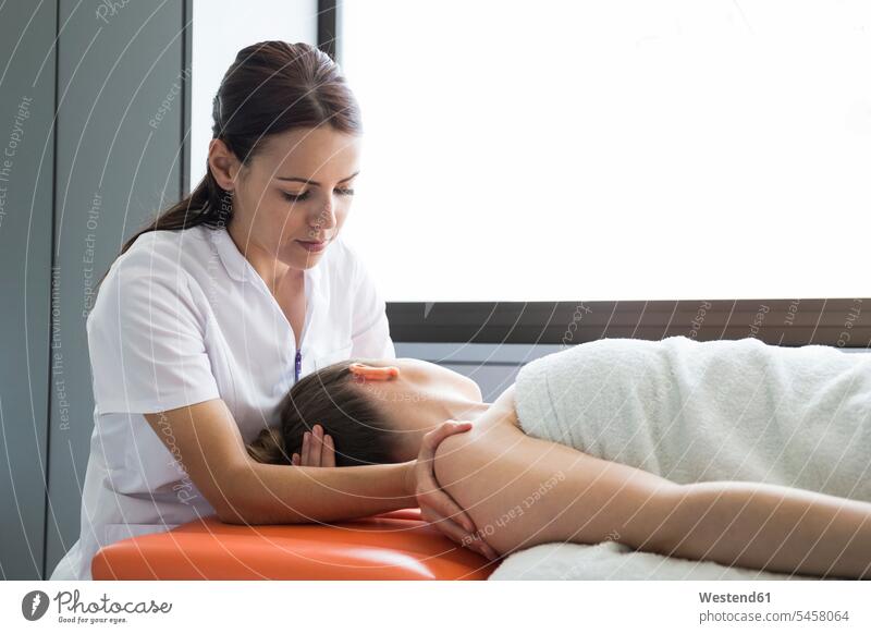 Hands of female physiotherapist massaging the hand of a woman human human being human beings humans person persons caucasian appearance caucasian ethnicity