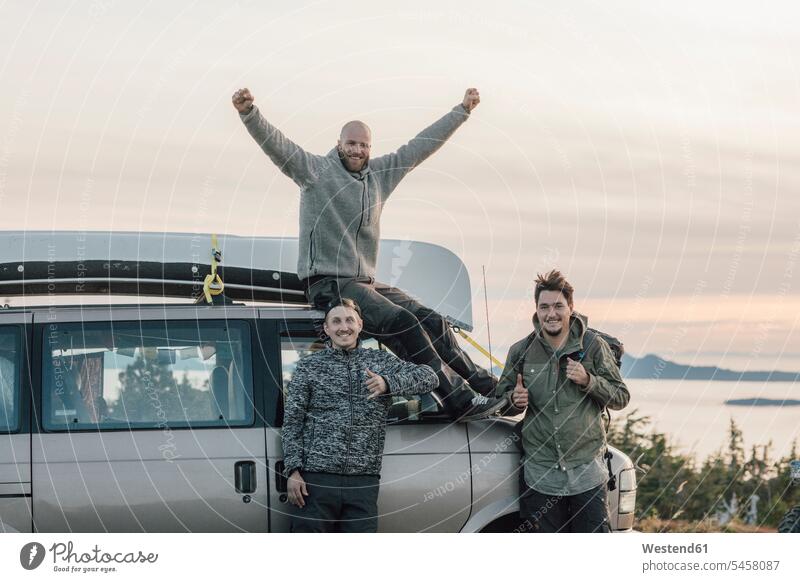 Canada, British Columbia, Prince Rupert, happy friends at minivan mate happiness portrait portraits man men males friendship Adults grown-ups grownups adult