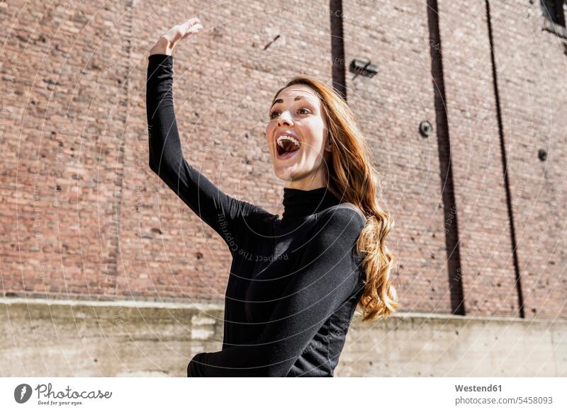 Portrait of excited woman calling someone portrait portraits females women excitement exciting exited Adults grown-ups grownups adult people persons human being
