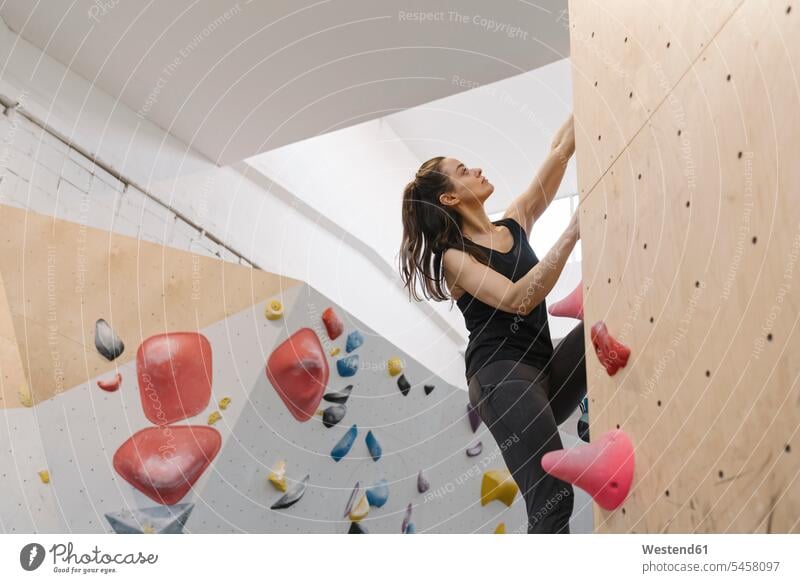 Woman bouldering in climbing gym (value=0) exercise practising train training hold free time leisure time Recreational Activities Recreational Activity