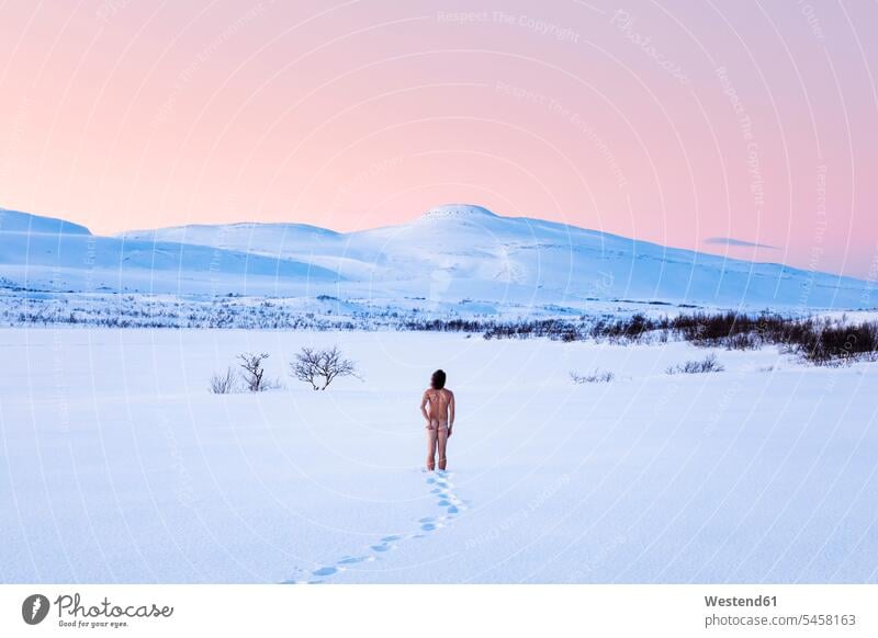 Nude man standing in winter landscape, Lebesby, Norway human human being human beings humans person persons caucasian appearance caucasian ethnicity european 1