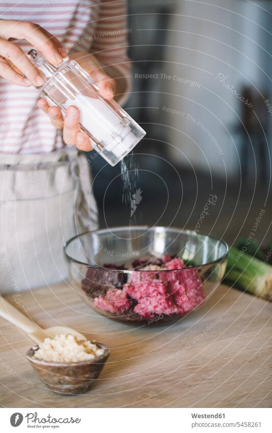 Preparation of beetroot ravioli with sage and butter, salting the filling in bowl Tradition traditional Traditions woman females women preparation prepare