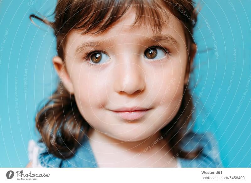 Portrait of cute little girl, blue background human human being human beings humans person persons caucasian appearance caucasian ethnicity european 1