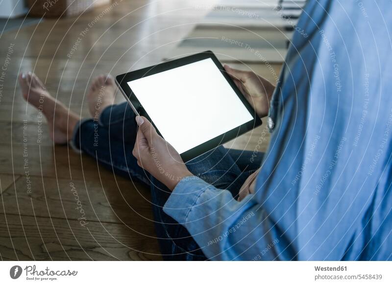 Young woman using tablet at home, copy space human human being human beings humans person persons caucasian appearance caucasian ethnicity european 1