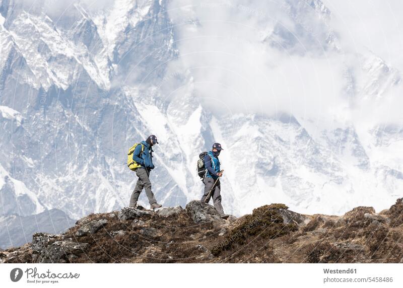 Nepal, Solo Khumbu, Everest, Mountaineer and sherpa walking in the mountains endurance journey travelling Journeys voyage Risk risky climber alpinists climbers