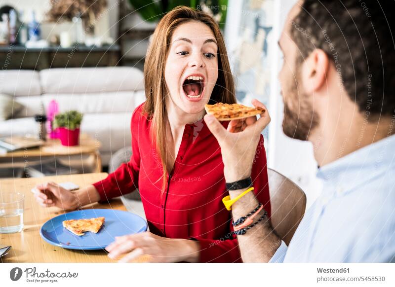 Friends having fun, sharing pizza Fun funny Pizza Pizzas eating friends together Food foods food and drink Nutrition Alimentation Food and Drinks friendship