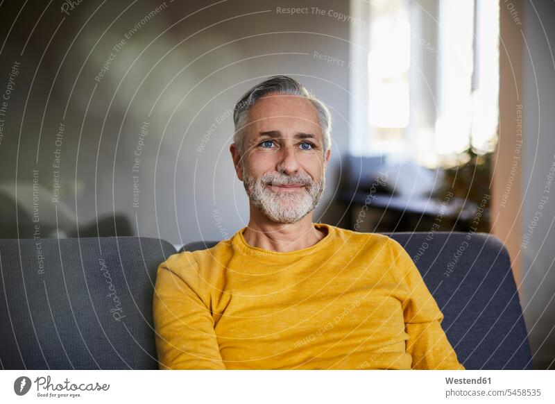 Portrait of confident mature man at home human human being human beings humans person persons celibate celibates singles solitary people solitary person