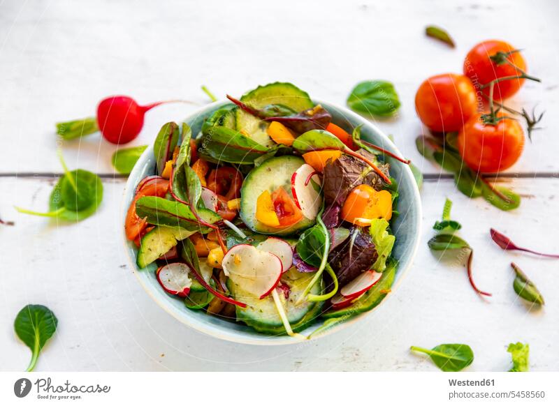 Salad with cucumber, tomato, red radish and bell pepper Bowl Bowls raw healthy eating nutrition Snack Snacks Snack Food garnished ready to eat ready-to-eat