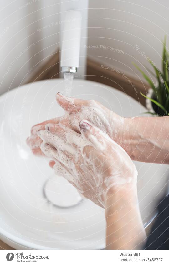 Close-up of woman washing her hand with soap Contemporary indoor interior shot indoors interiour photo interiour photos interiour shots detail close-up