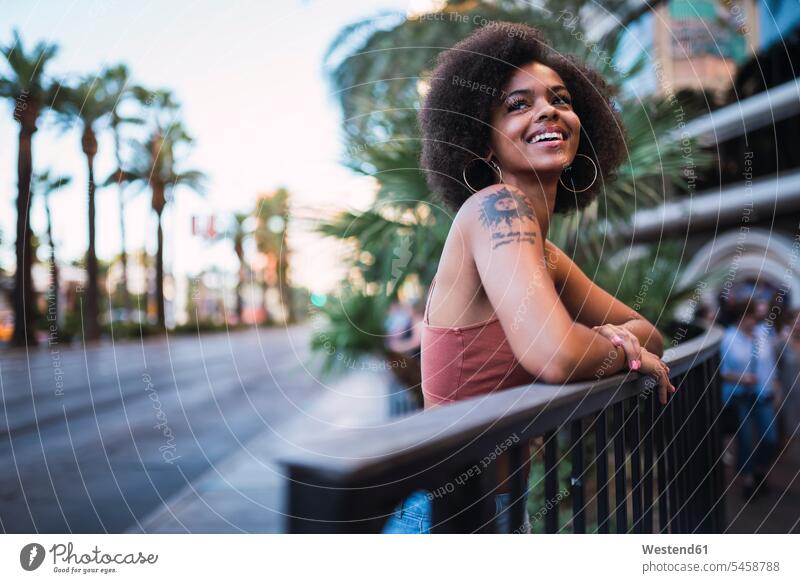 USA, Nevada, Las Vegas, portrait of happy young woman in the city portraits town cities towns females women happiness outdoors outdoor shots location shot