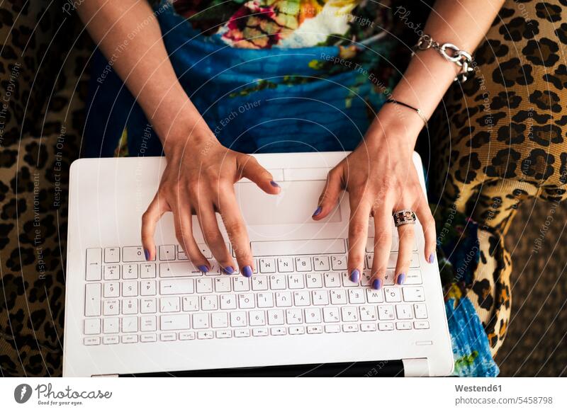Close-up of woman's hands working on laptop at home color image colour image indoors indoor shot indoor shots interior interior view Interiors day daylight shot