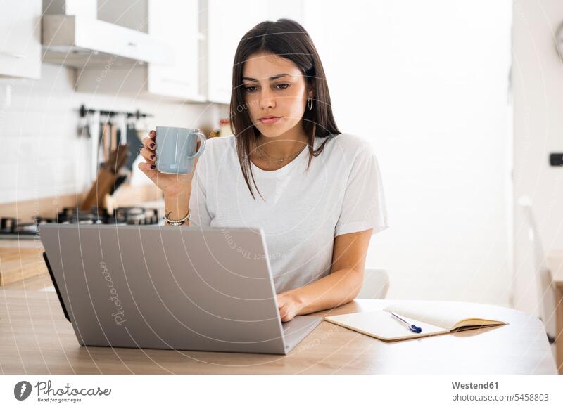 Young woman using laptop at home human human being human beings humans person persons caucasian appearance caucasian ethnicity european 1 one person only