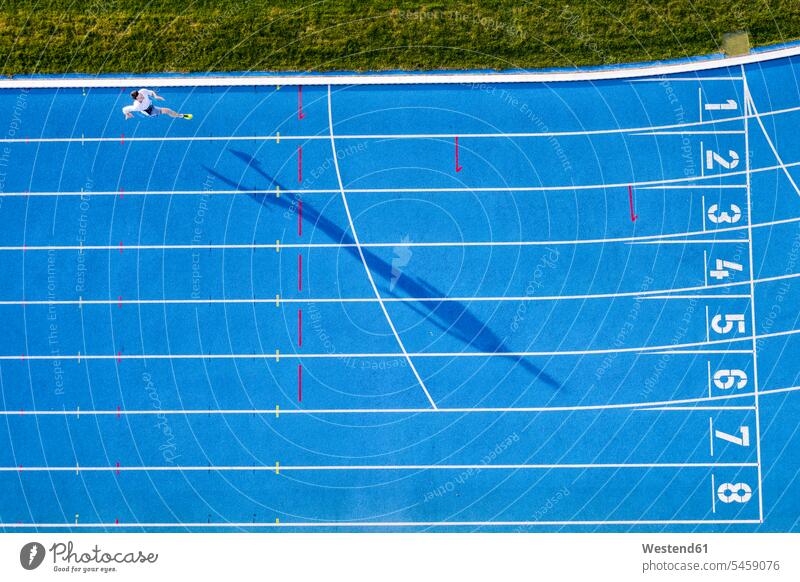 Top view of runner on blue tartan track human human being human beings humans person persons caucasian appearance caucasian ethnicity european 1 one person only