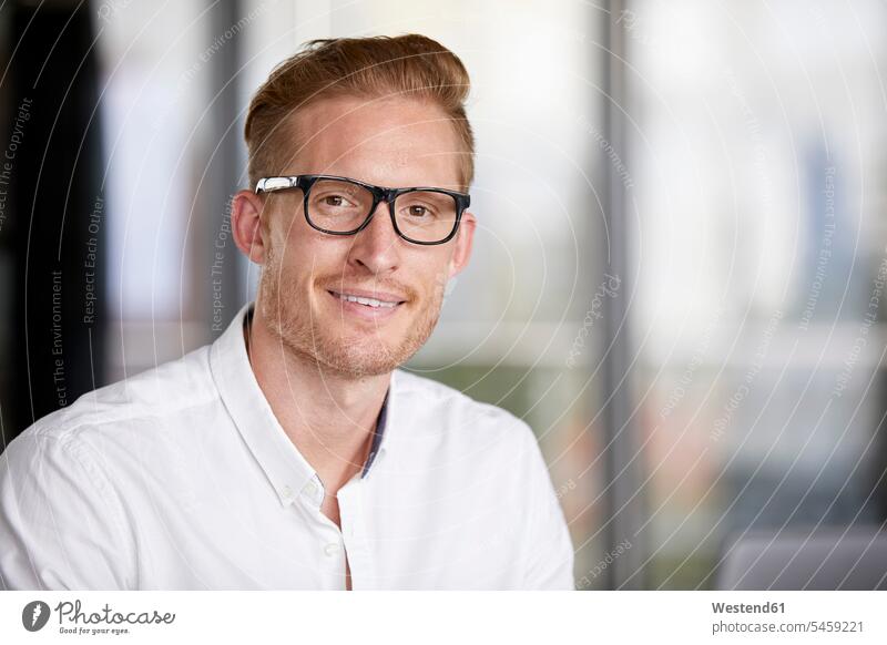 Portrait of smiling redheaded businessman wearing glasses specs Eye Glasses spectacles Eyeglasses smile red hair red hairs red-haired Businessman Business man