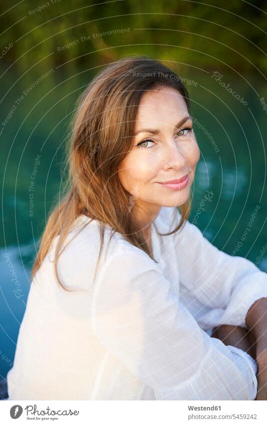Portrait of mature woman at a lake human human being human beings humans person persons caucasian appearance caucasian ethnicity european 1 one person only