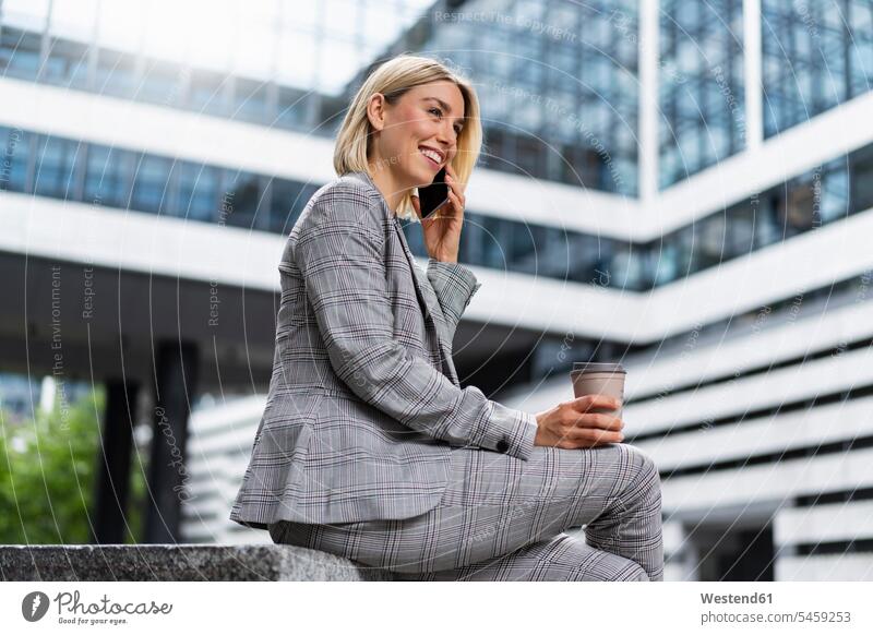 Happy young businesswoman on the phone in the city business life business world business person businesspeople business woman business women businesswomen