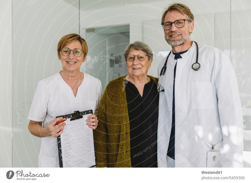 Portrait of doctor, assistant and senior patient in medical practice health healthcare Healthcare And Medicines medicine disease diseases ill illnesses sick