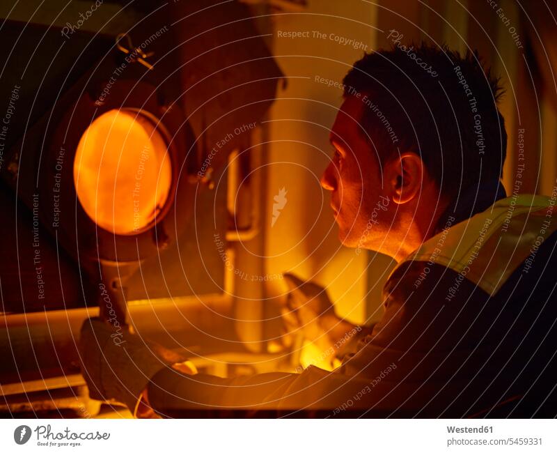 Worker controlling of combustion in furnace worker blue collar worker workers blue-collar worker Blast Furnace factory Control timber industry wood industry
