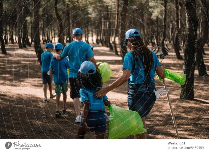 Group of volunteers collecting garbage in a park human human being human beings humans person persons caucasian appearance caucasian ethnicity european
