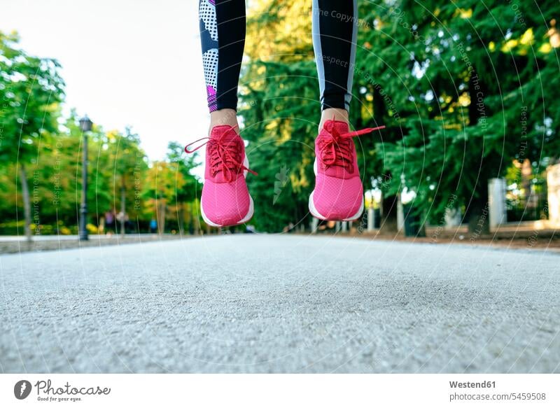 Close-up of woman's feet with pink running shoes jumping colour colours magenta light free time leisure time Recreational Activities Recreational Activity