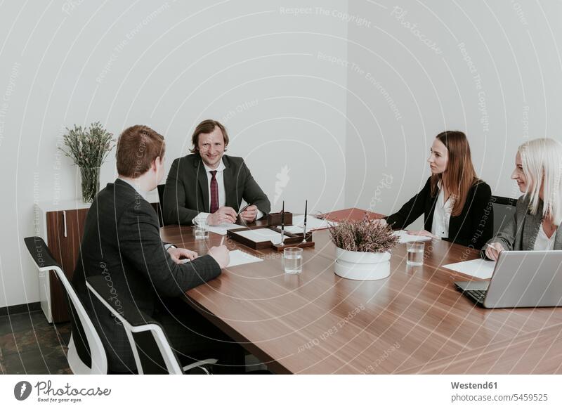Business people having a meeting in conference room team talking conversations technology technologies Technological manager managers laptop Laptop Computers