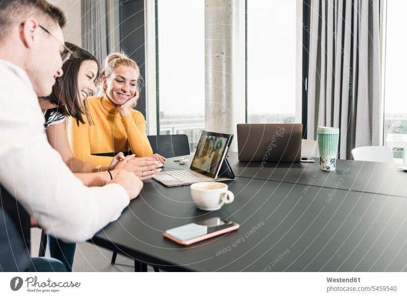 Colleagues having a video conference in conference room human human being human beings humans person persons caucasian appearance caucasian ethnicity european