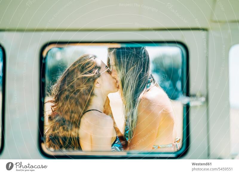 Lesbian couple doing a road trip, kissing and embracing in nature homosexual woman lesbians gay women gay woman homosexual women Lesbian Couple Lesbians kisses