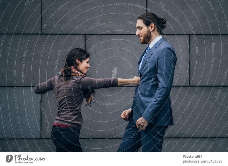 Businessman and woman fighting females women Business man Businessmen Business men Adults grown-ups grownups adult people persons human being humans