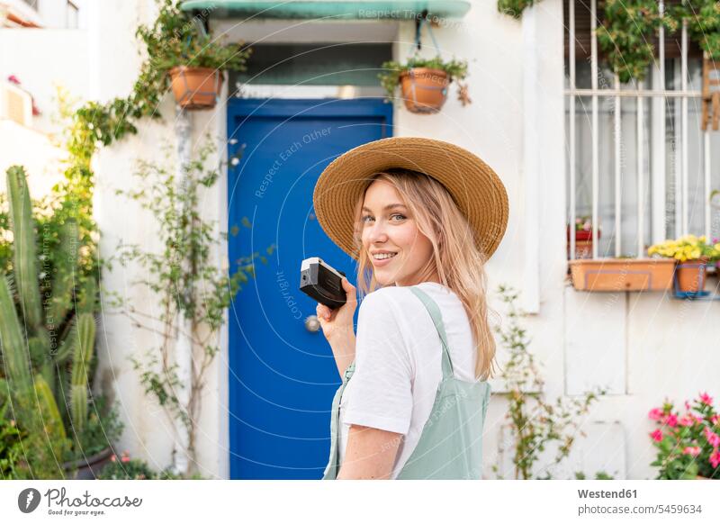 Portrait of smiling young woman with camera human human being human beings humans person persons caucasian appearance caucasian ethnicity european 1