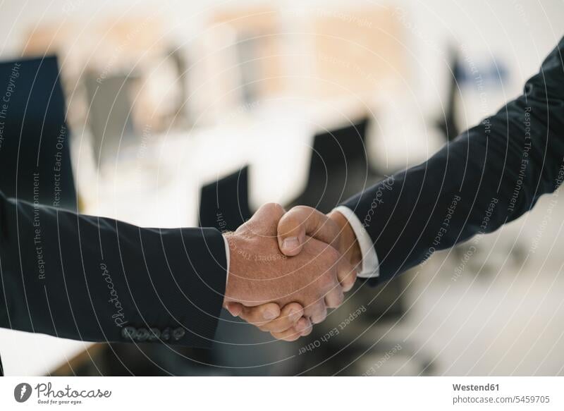 Two businessmen shaking hands business life business world business person businesspeople associate associates business associate business associates
