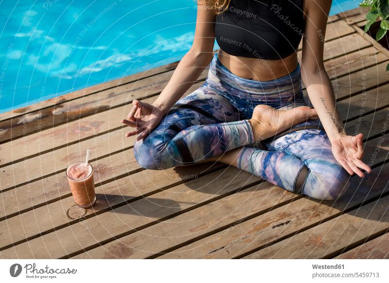 Woman practicing yoga at poolside, Costa Rica Holidays human human being human beings humans person persons human leg human legs 1 one person only