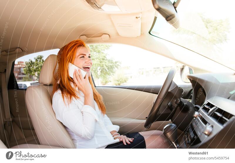 Happy business woman using her smartphone in a car human human being human beings humans person persons caucasian appearance caucasian ethnicity european 1