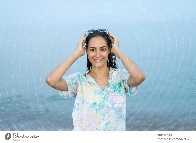 Portrait of smiling woman in front of the sea Sea ocean smile portrait portraits females women water Adults grown-ups grownups adult people persons human being