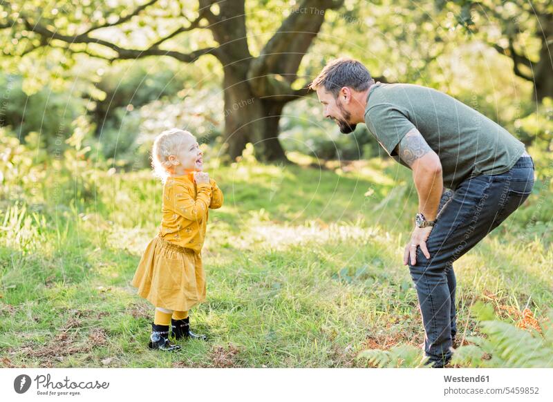 Father and little daughter together on a meadow human human being human beings humans person persons caucasian appearance caucasian ethnicity european 2