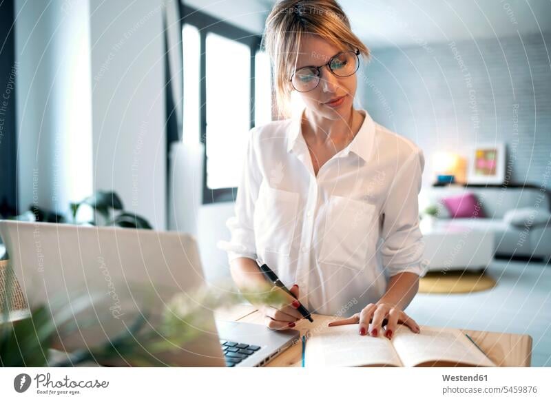 Freelancer working at home color image colour image indoors indoor shot indoor shots interior interior view Interiors businesswoman businesswomen business woman
