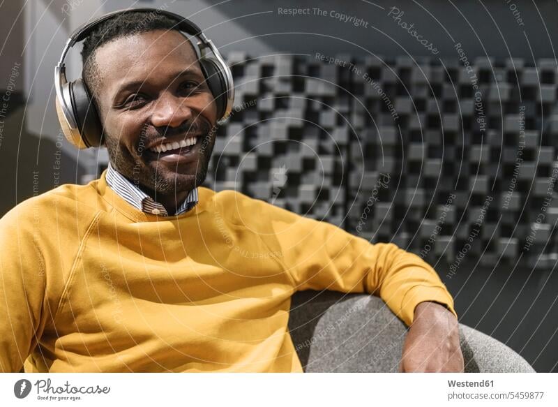 Portrait of a happy man with headphones human human being human beings humans person persons African black black ethnicity coloured 1 one person only