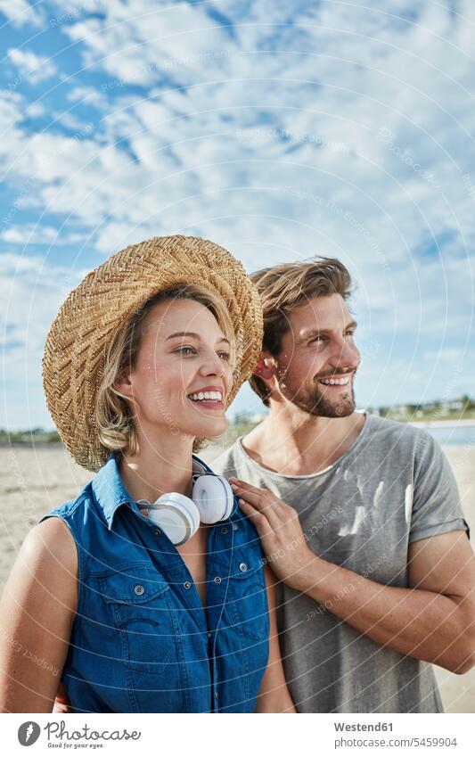 Happy young couple on the beach twosomes partnership couples beaches happiness happy people persons human being humans human beings Germany bonding relationship
