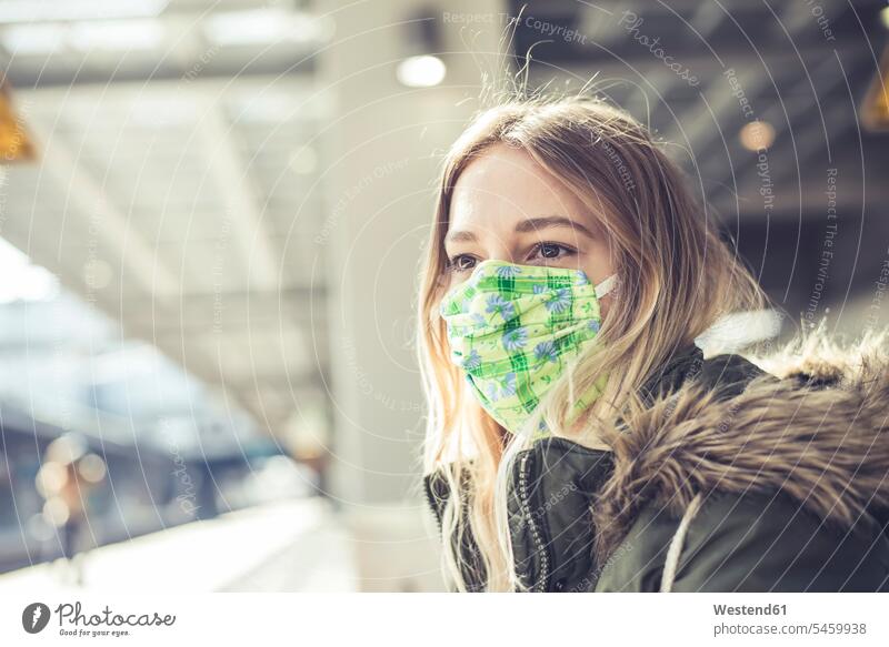 Portrait of young woman wearing mask at station platform human human being human beings humans person persons caucasian appearance caucasian ethnicity european